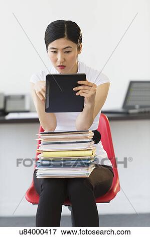 Businesswoman using tablet pc View Large Photo Image Stock Photo - Businesswoman using tablet pc. Fotosearch