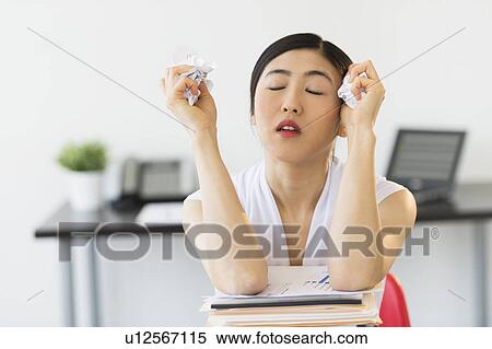 Stock Photography - Businesswoman with stack of files. Fotosearch