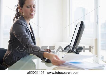 Busy woman in office View Large Photo Image Stock Photography - Busy woman in office. Fotosearch