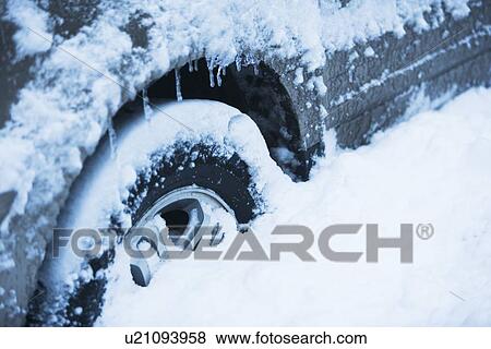 Car tire covered by snow, Close-up View Large Photo Image Stock Photo - Car tire covered by snow, Close-up. Fotosearch