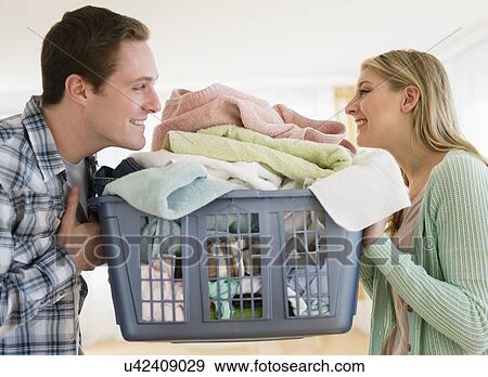 Couple doing laundry View Large Photo Image Stock Photo - Couple doing laundry. Fotosearch