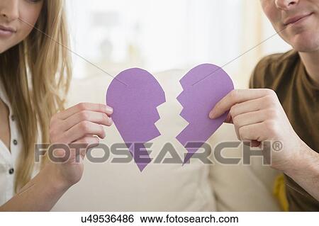 Couple holding broken heart View Large Photo Image Stock Photograph - Couple holding broken heart. Fotosearch