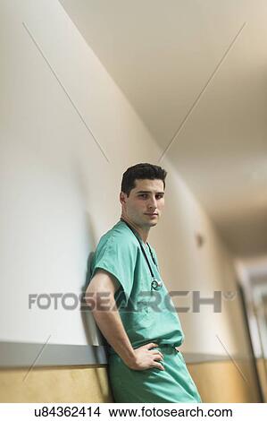 Doctor standing in hallway View Large Photo Image Picture - Doctor standing in hallway. Fotosearch