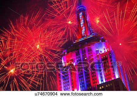 Empire state building with firework display View Large Photo Image Picture - Empire state building with firework display. Fotosearch