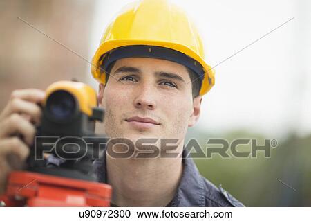 Engineer using theodolite View Large Photo Image Stock Image - Engineer using theodolite. Fotosearch