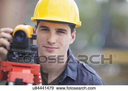 Engineer using theodolite View Large Photo Image Stock Photo - Engineer using theodolite. Fotosearch