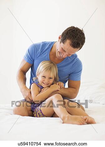Picture - Father playing with daughter (2-3). Fotosearch