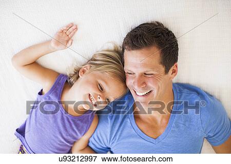 Stock Photo - Father playing with daughter (2-3). Fotosearch