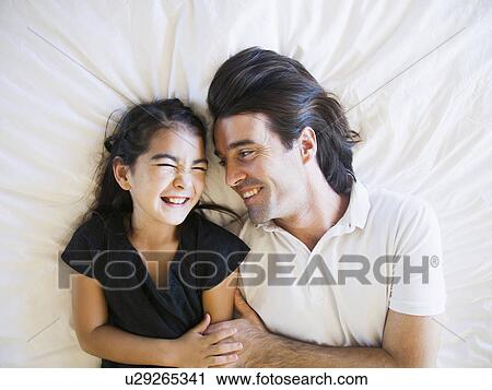 Father with daughter (8-9) laughing View Large Photo Image Stock Image - Father with daughter (8-9) laughing . Fotosearch