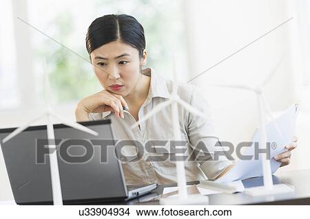 Female engineer working on laptop View Large Photo Image Picture - Female engineer working on laptop. Fotosearch