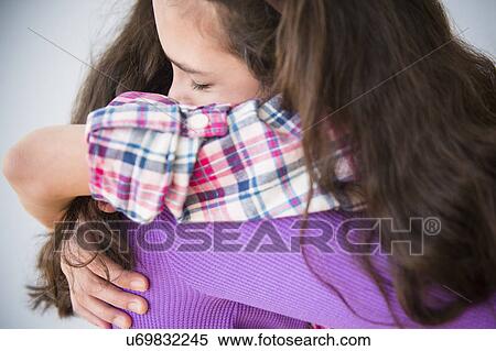 Friends in close embrace View Large Photo Image Stock Photography - Friends in close embrace. Fotosearch