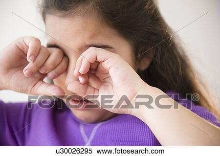 Girl (8-9) crying and covering eyes View Large Photo Image Stock Photography - Girl (8-9) crying and covering eyes. Fotosearch