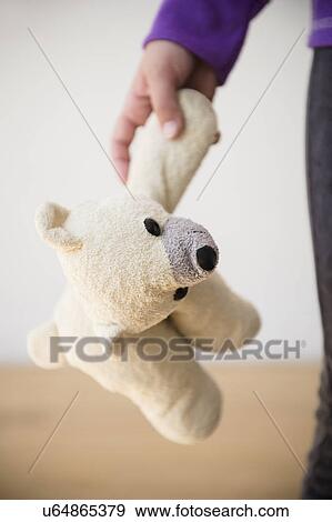 Girl (8-9) holding teddy bear View Large Photo Image Stock Photo - Girl (8-9) holding teddy bear. Fotosearch