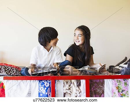 Girls (8-9) reading book View Large Photo Image Stock Image - Girls (8-9) reading book. Fotosearch
