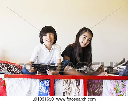 Girls (8-9) reading book View Large Photo Image Stock Image - Girls (8-9) reading book. Fotosearch