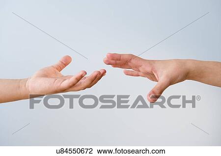 Hands reaching for each other View Large Photo Image Stock Image - Hands reaching for each other. Fotosearch