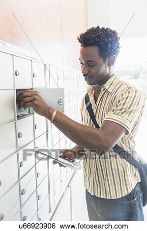 Man checking mailbox View Large Photo Image Stock Photograph - Man checking mailbox. Fotosearch