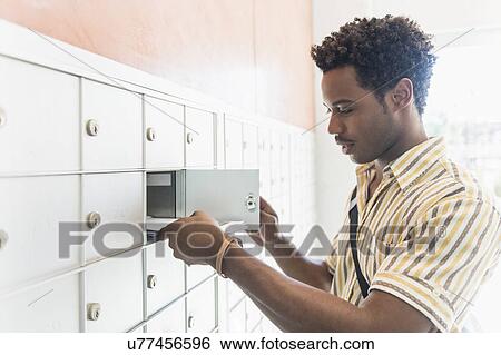 Man checking mailbox View Large Photo Image Stock Photograph - Man checking mailbox. Fotosearch