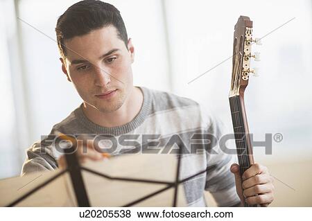 Stock Photo - Man composing music. Fotosearch