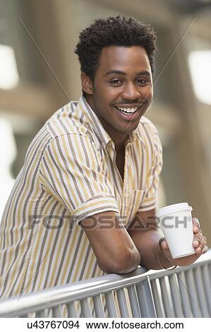 Man drinking coffee outdoors View Large Photo Image Picture - Man drinking coffee outdoors. Fotosearch