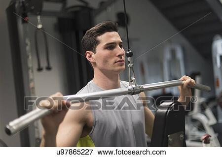 Man exercising in gym View Large Photo Image Stock Photo - Man exercising in gym. Fotosearch