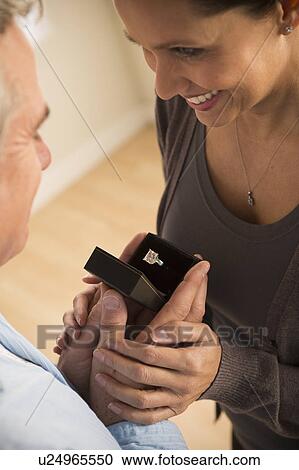 Mature man proposing to mature woman View Large Photo Image Stock Image - Mature man proposing to mature woman. Fotosearch