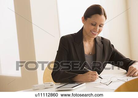 Mature woman at work View Large Photo Image Stock Image - Mature woman at work. Fotosearch