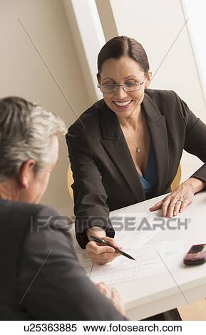 Mature woman working with mature man View Large Photo Image Stock Photography - Mature woman working with mature man. Fotosearch