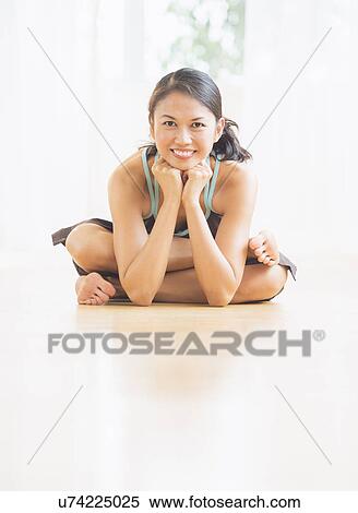 Mid adult woman practicing yoga View Large Photo Image Stock Photography - Mid adult woman practicing yoga. Fotosearch