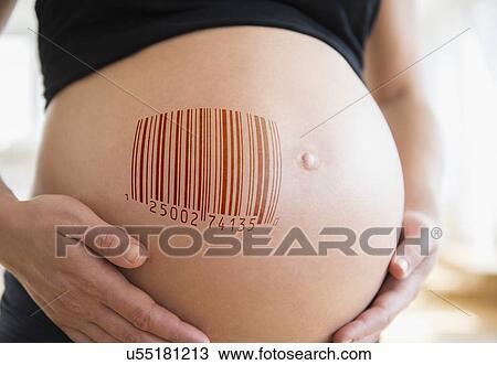 Stock Image - Mid section of pregnant woman with bar code on her belly. Fotosearch