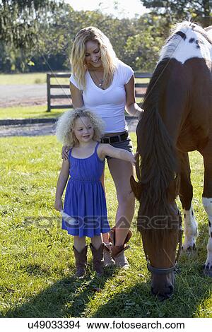 Picture - Mother with daughter (4-5) outdoors. Fotosearch