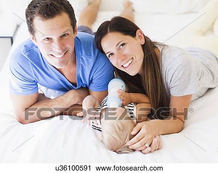 Parents with baby boy (6-11 months) View Large Photo Image Stock Image - Parents with baby boy (6-11 months). Fotosearch