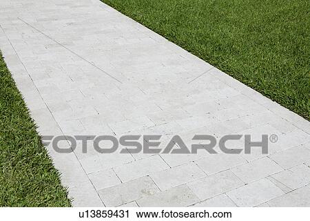 Pavement between grass View Large Photo Image Stock Image - Pavement between grass. Fotosearch