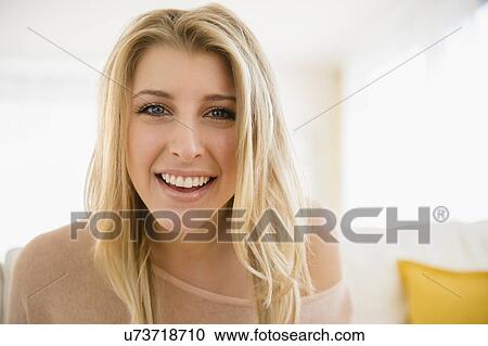 Stock Image - Portrait of beautiful woman smiling. Fotosearch