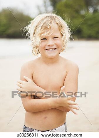 Portrait of boy (6-7) on beach View Large Photo Image Stock Image - Portrait of boy (6-7) on beach. Fotosearch