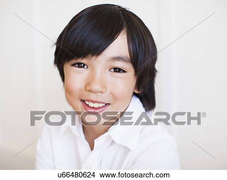 Portrait of boy (8-9) in white shirt View Large Photo Image Picture - Portrait of boy (8-9) in white shirt. Fotosearch