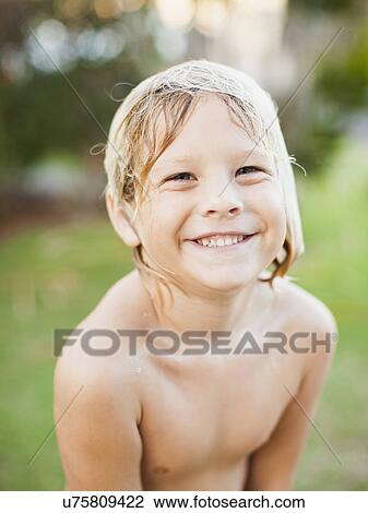 Portrait of boy (8-9) smiling View Large Photo Image Stock Image - Portrait of boy (8-9) smiling. Fotosearch