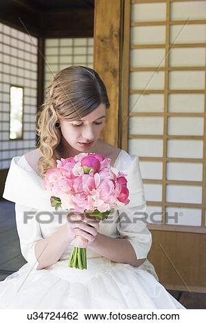 Portrait of bride with bouquet of pink flowers View Large Photo Image Stock Image - Portrait of bride with bouquet of pink flowers. Fotosearch