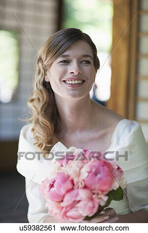 Portrait of bride with bouquet of pink flowers View Large Photo Image Stock Image - Portrait of bride with bouquet of pink flowers. Fotosearch