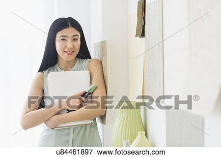 Stock Photo - Portrait of business woman in office. Fotosearch