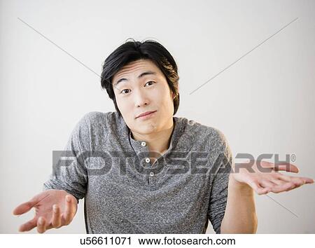 Portrait of confused young man View Large Photo Image Stock Image - Portrait of confused young man. Fotosearch