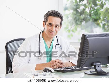 Stock Photo - Portrait of doctor in office. Fotosearch