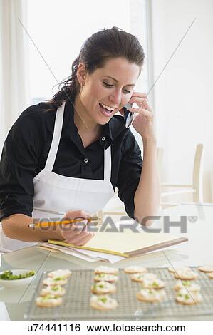 Stock Photograph - Portrait of entrepreneur talking on phone. Fotosearch