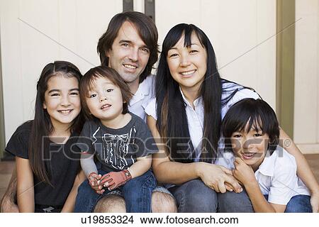 Portrait of family with three kids (2-3, 8-9) View Large Photo Image Picture - Portrait of family with three kids (2-3, 8-9). Fotosearch