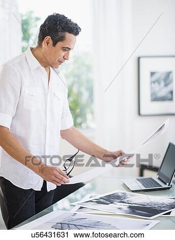 Portrait of man in his photography studio View Large Photo Image Stock Image - Portrait of man in his photography studio. Fotosearch