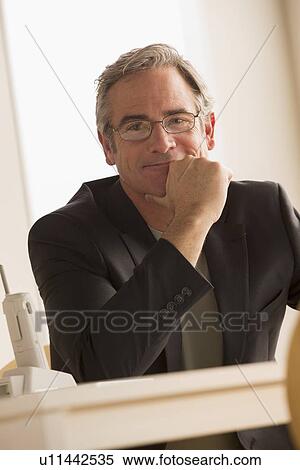 Stock Photography - Portrait of mature business person. Fotosearch