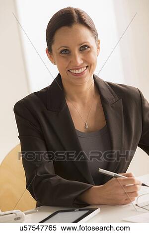Stock Photography - Portrait of mature elegant woman at work. Fotosearch