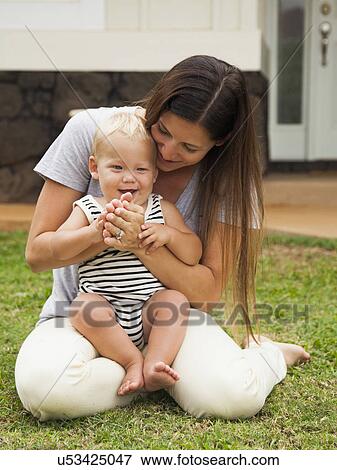 Portrait of mother with baby boy (6-11 months) View Large Photo Image Stock Photo - Portrait of mother with baby boy (6-11 months). Fotosearch