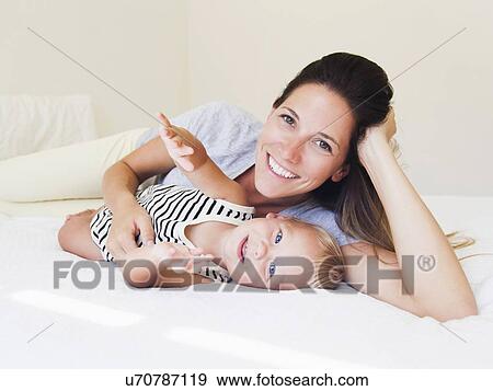 Portrait of mother with baby boy (6-11 months) View Large Photo Image Stock Photo - Portrait of mother with baby boy (6-11 months). Fotosearch