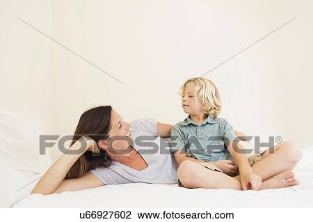 Stock Image - Portrait of mother with son (6-7). Fotosearch